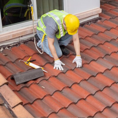 A client's home is having Spanish tiles installed for their roof replacement.