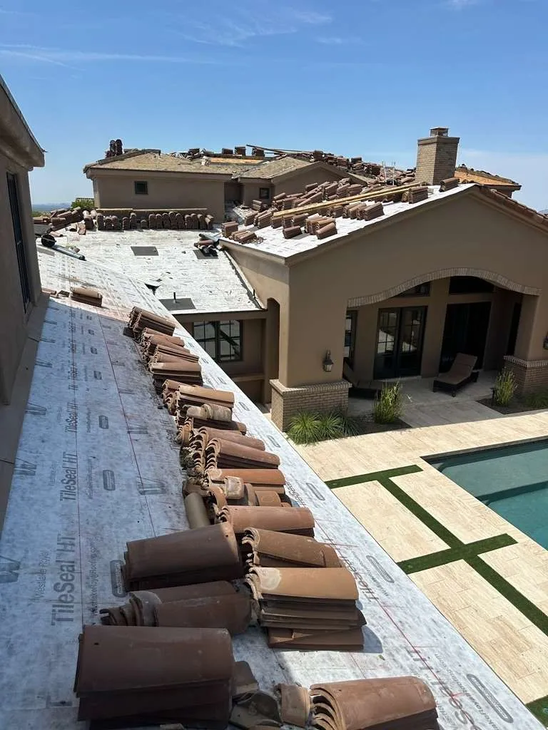 DC Ranch house with tiles staged on the roof prior to installation.