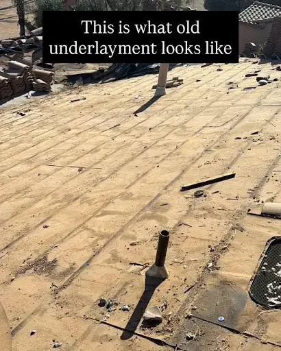 what-to-do-after-a-monsoon | Triumph Roofing Old, damaged roof underlayment with debris and a vent pipe protruding through a dirty roof surface (illustrates what old underlayment looks like).